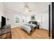 Bright bedroom with hardwood floors, fan, and ample natural light at 5968 Reddington Way, Sandy Springs, GA 30328