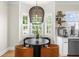Cozy breakfast nook featuring bay windows and a modern light fixture at 5968 Reddington Way, Sandy Springs, GA 30328