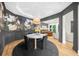 Charming dining area featuring decorative wallpaper, a modern chandelier, and an open floor plan at 5968 Reddington Way, Sandy Springs, GA 30328