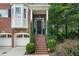 Inviting front entrance featuring brick stairs and a covered porch at 5968 Reddington Way, Sandy Springs, GA 30328