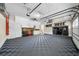 Well-organized garage with storage, work area, finished floor and ample space for vehicles and projects at 5968 Reddington Way, Sandy Springs, GA 30328