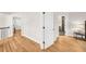 Hallway with hardwood floors showing entry to bedroom and bathroom at 5968 Reddington Way, Sandy Springs, GA 30328
