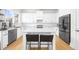 Modern kitchen with a center island and stainless steel appliances at 5968 Reddington Way, Sandy Springs, GA 30328