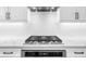Close up of a kitchen cooktop with range hood at 5968 Reddington Way, Sandy Springs, GA 30328