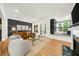 Spacious living room with hardwood floors, fireplace, and access to an office space for a work-from-home lifestyle at 5968 Reddington Way, Sandy Springs, GA 30328