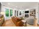 Comfortable living room with fireplace, hardwood floors, and views of the private outdoor space at 5968 Reddington Way, Sandy Springs, GA 30328