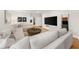 Comfortable living room with a large sectional sofa and natural light at 5968 Reddington Way, Sandy Springs, GA 30328