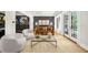 Open concept living room featuring stylish furniture, hardwood floors, and a neutral color palette at 5968 Reddington Way, Sandy Springs, GA 30328