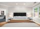 Inviting main bedroom with hardwood floors and an ensuite bathroom featuring a soaking tub at 5968 Reddington Way, Sandy Springs, GA 30328