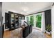 Well-lit office with large windows, hardwood flooring, and custom built-in cabinets at 5968 Reddington Way, Sandy Springs, GA 30328