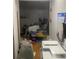Unfinished basement area filled with various items and clutter near a calendar and other objects at 6701 Knollwood Cir, Douglasville, GA 30135