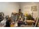 Unfinished basement area with painting supplies and boxes piled high and assorted disorganized items at 6701 Knollwood Cir, Douglasville, GA 30135