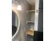 Small bathroom with open shelving beside the sink at 6701 Knollwood Cir, Douglasville, GA 30135
