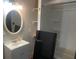 Small bathroom with a tub, shower and single sink vanity at 6701 Knollwood Cir, Douglasville, GA 30135