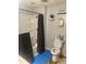 Small bathroom showing the toilet, tub/shower, and beach decor at 6701 Knollwood Cir, Douglasville, GA 30135