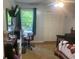 Bedroom with desk, sewing machine, and closet at 6701 Knollwood Cir, Douglasville, GA 30135