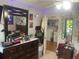 Bedroom with a large dresser and view into laundry room at 6701 Knollwood Cir, Douglasville, GA 30135