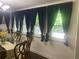 Bright dining room with natural light and stylish window treatments at 6701 Knollwood Cir, Douglasville, GA 30135