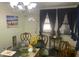 Open dining area with natural light and a decorative chandelier at 6701 Knollwood Cir, Douglasville, GA 30135