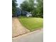 View of the home's front exterior, showcasing its curb appeal and landscape at 6701 Knollwood Cir, Douglasville, GA 30135