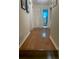 Hallway with wood flooring leading to bedrooms and a bathroom at 6701 Knollwood Cir, Douglasville, GA 30135