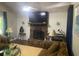 Inviting living room with fireplace and entertainment center at 6701 Knollwood Cir, Douglasville, GA 30135