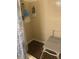Shower with safety chair, nautical theme, and tile flooring at 6701 Knollwood Cir, Douglasville, GA 30135