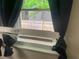 Window with trim and dark curtains at 6701 Knollwood Cir, Douglasville, GA 30135