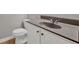 Bathroom with a dark countertop, white cabinet, and standard toilet at 1707 Taylor Ave, Atlanta, GA 30344
