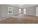 Large bedroom featuring plush carpeting and natural light from multiple windows at 1707 Taylor Ave, Atlanta, GA 30344