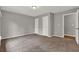 Bedroom featuring neutral paint, plush carpet, and a bright light fixture at 1707 Taylor Ave, Atlanta, GA 30344