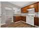 Bright kitchen with stainless steel appliances and wood cabinets at 1707 Taylor Ave, Atlanta, GA 30344