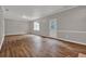 Open living room with hardwood floors, fresh neutral paint, and natural light at 1707 Taylor Ave, Atlanta, GA 30344
