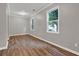 Well-lit living room with hardwood floors and ample natural light from two windows at 1707 Taylor Ave, Atlanta, GA 30344