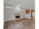 Bright living room showcases wood floors, fireplace, and a view into the kitchen at 1707 Taylor Ave, Atlanta, GA 30344