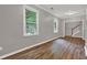 Spacious living room with hardwood floors and two large windows for natural light at 1707 Taylor Ave, Atlanta, GA 30344
