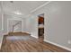Living room with hardwood floors and a view of the stairs and kitchen at 1707 Taylor Ave, Atlanta, GA 30344