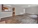 This open-concept living room features wood floors with a bar overlooking the kitchen at 1707 Taylor Ave, Atlanta, GA 30344