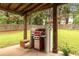 Backyard patio area with grill at 2205 Waters Ferry Dr, Lawrenceville, GA 30043