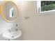 Bright bathroom features a stylish sink and a window that brings in natural light at 2205 Waters Ferry Dr, Lawrenceville, GA 30043