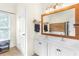 Bright bathroom featuring double sinks and wood accents at 2205 Waters Ferry Dr, Lawrenceville, GA 30043