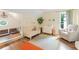 Cozy Bedroom with a crib, soft rug, comfortable chair, and unique playroom at 2205 Waters Ferry Dr, Lawrenceville, GA 30043