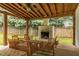 Covered patio with outdoor fireplace at 2205 Waters Ferry Dr, Lawrenceville, GA 30043