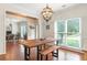 Dining room with wood beams, modern lighting, and hardwood floors at 2205 Waters Ferry Dr, Lawrenceville, GA 30043