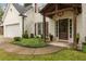 Inviting entrance with a wood-covered front porch and well-maintained landscaping at 2205 Waters Ferry Dr, Lawrenceville, GA 30043