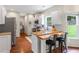 Charming kitchen features white cabinets, stainless steel appliances, and granite countertops at 2205 Waters Ferry Dr, Lawrenceville, GA 30043
