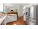 Modern kitchen features granite countertops, stainless steel appliances, and hardwood floors at 2205 Waters Ferry Dr, Lawrenceville, GA 30043