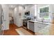Well-lit kitchen with stainless steel appliances and a subway tile backsplash at 2205 Waters Ferry Dr, Lawrenceville, GA 30043