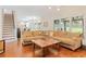 Bright and spacious living room with hardwood floors and a comfortable sectional sofa at 2205 Waters Ferry Dr, Lawrenceville, GA 30043