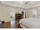 Relaxing main bedroom with hardwood floors and fireplace feature at 2205 Waters Ferry Dr, Lawrenceville, GA 30043